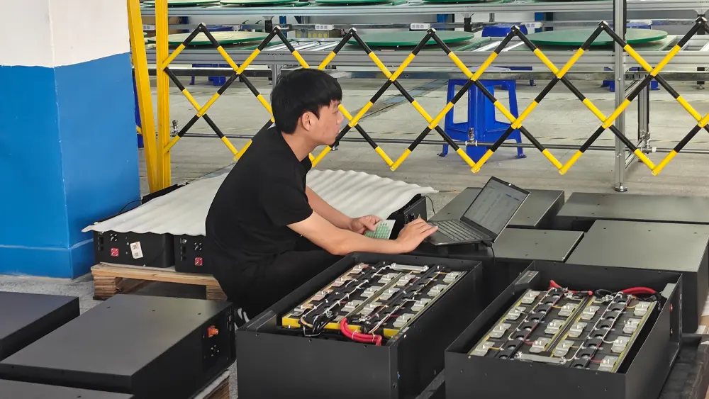 OEM battery and hybrid inverter undergoing CAN and RS485 protocol validation on a test bench